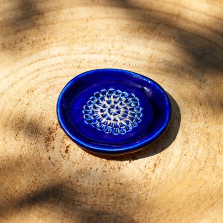 Gratte-ail en céramique bleu